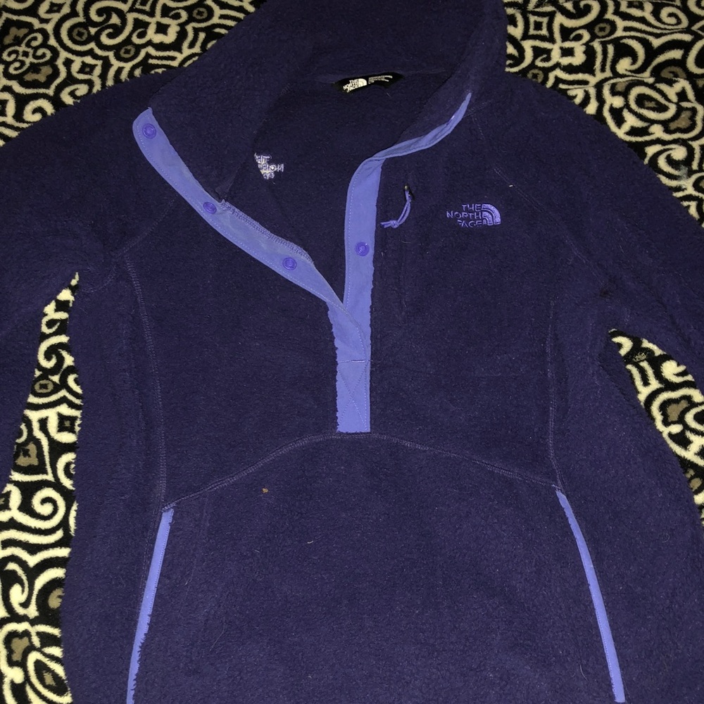 A purple North Face fleece